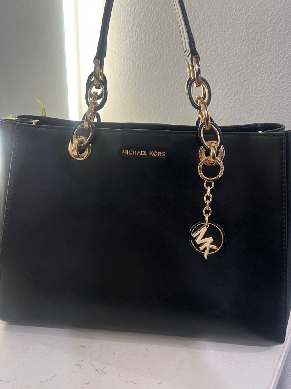 Michael Kors Black Leather Tote with Gold Accents and Logo Charm